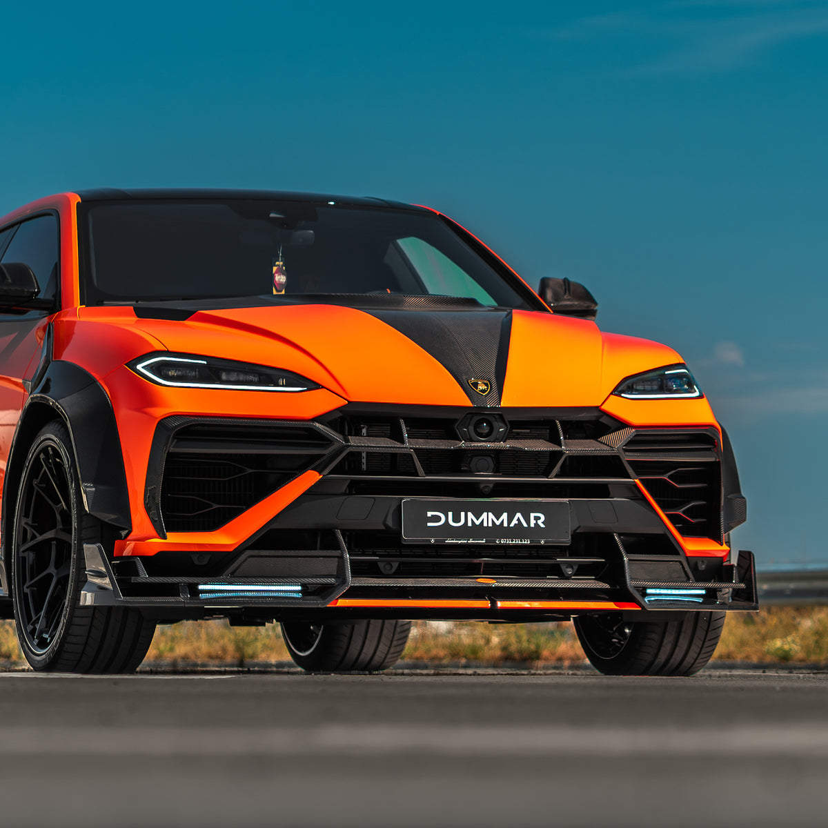 DUMMAR Urus SE front bumper extension with LED daytime running lights, installed front view