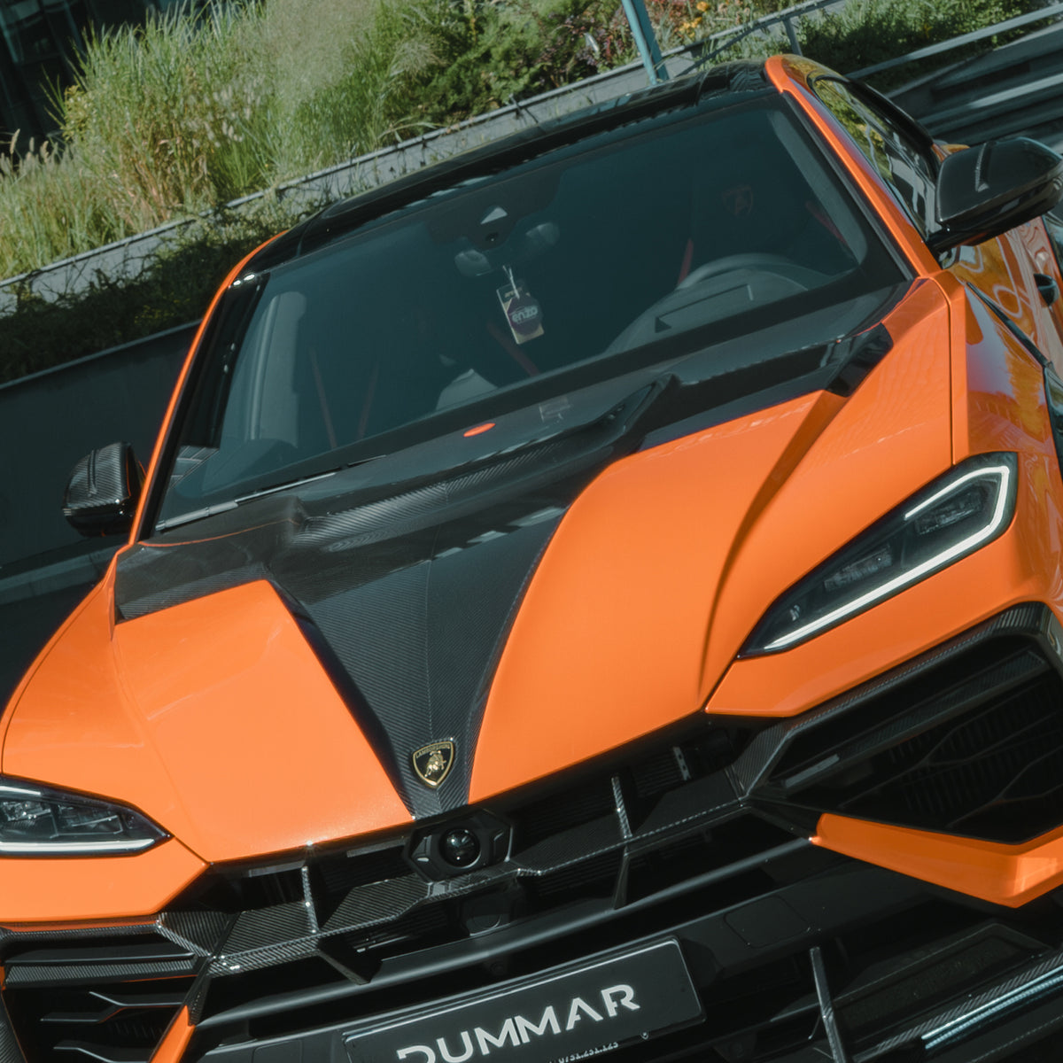 DUMMAR carbon bonnet fitted to an orange Lamborghini Urus SE