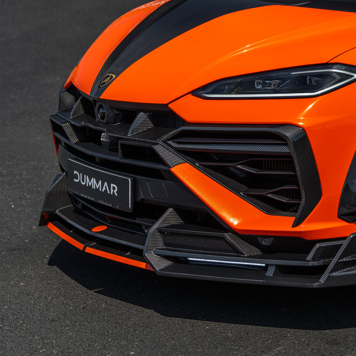DUMMAR three-piece carbon front fascia fitted to an orange Lamborghini Urus SE